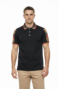 Man wearing a black polo shirt with plaid collar and arm sleeves on a white background