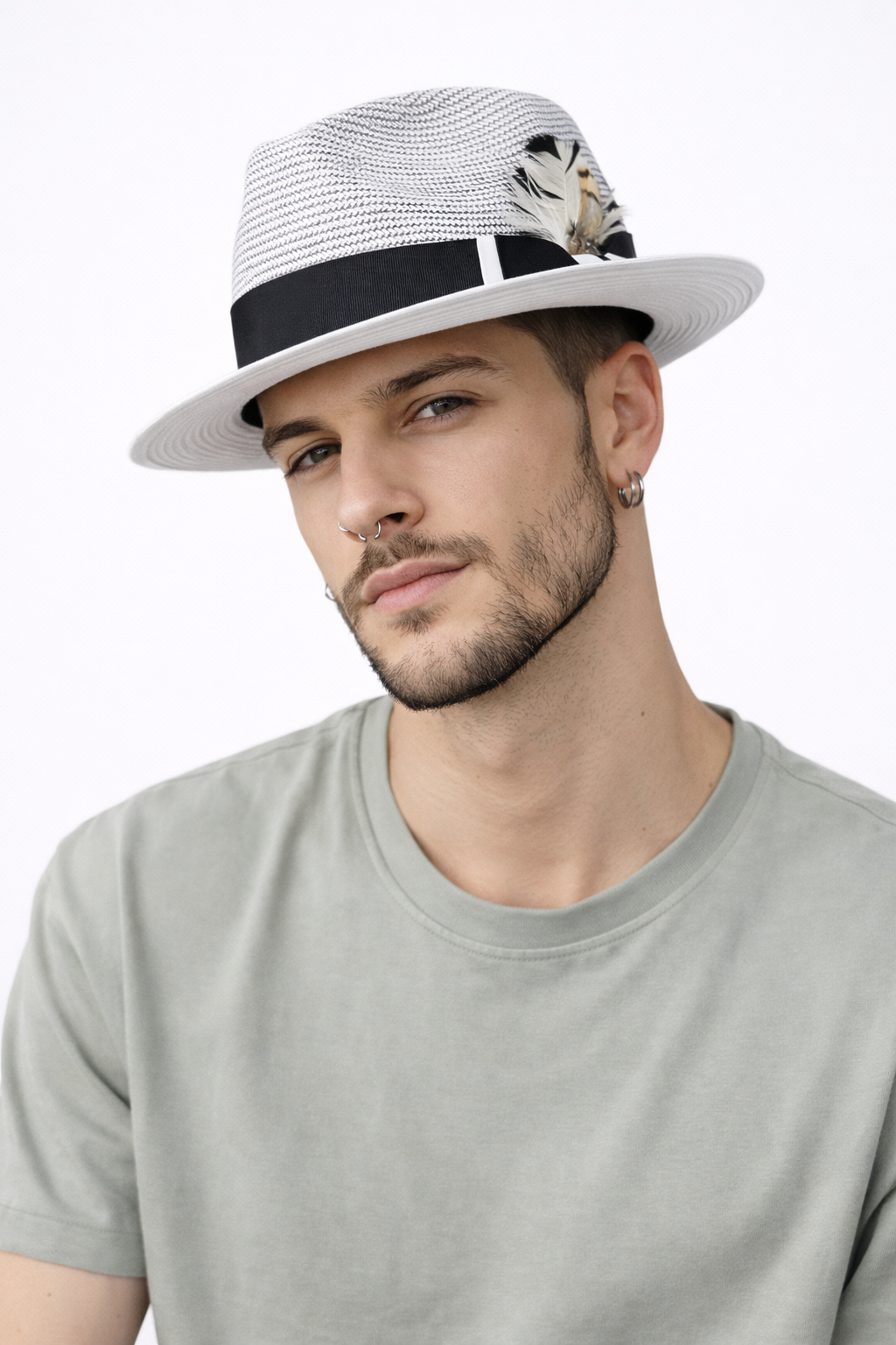 Man wearing a white fedora hat with a black band on a white background