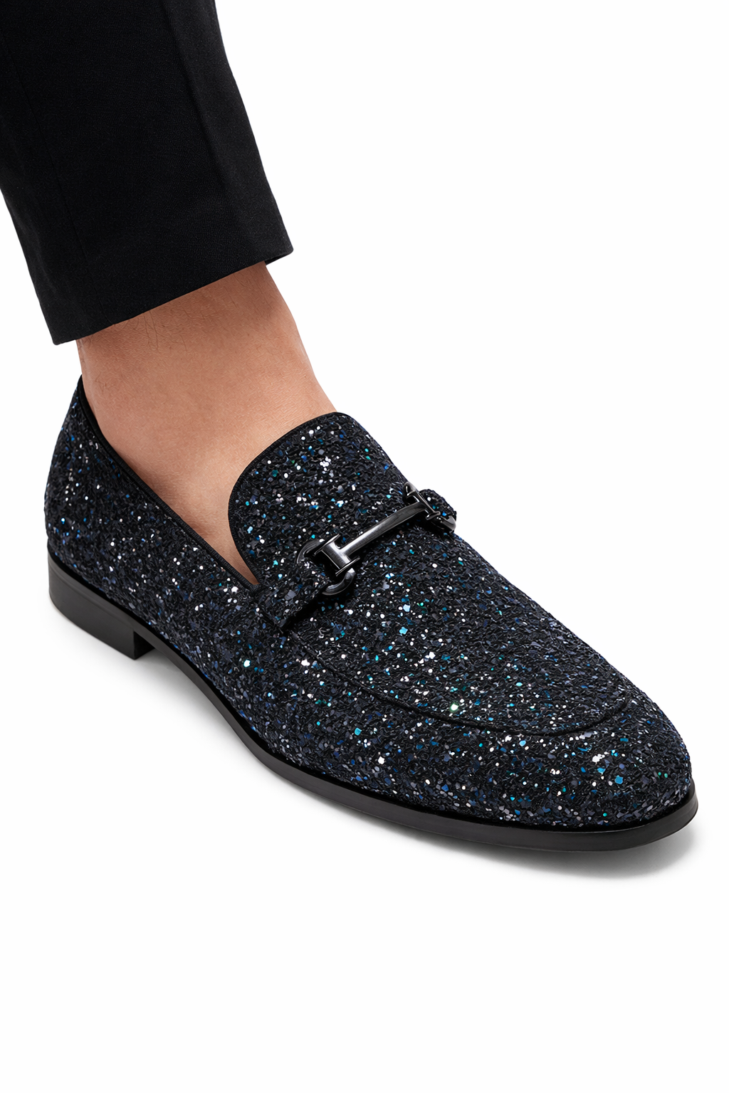 Black glittery loafer shoe on a white background